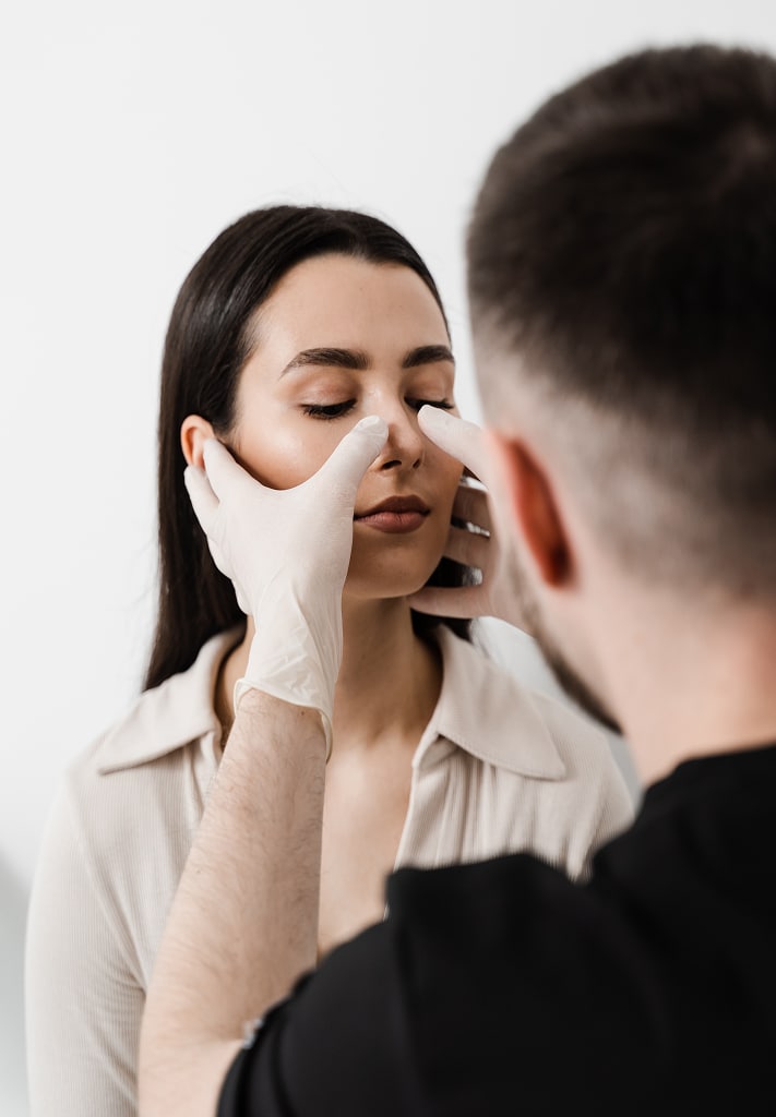 ENT doctor examines palpates nasal septum septoplasty surgery septoplasty is surgical correction defects deformities nasal septum